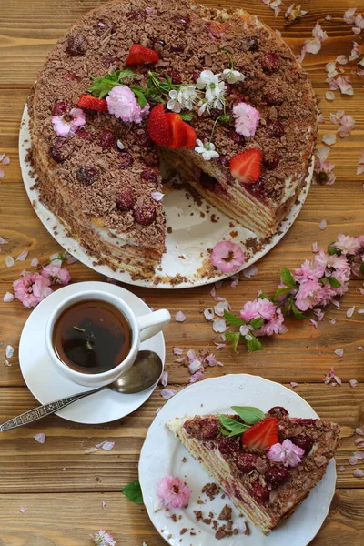 Still life with chocolate cake with strawberries