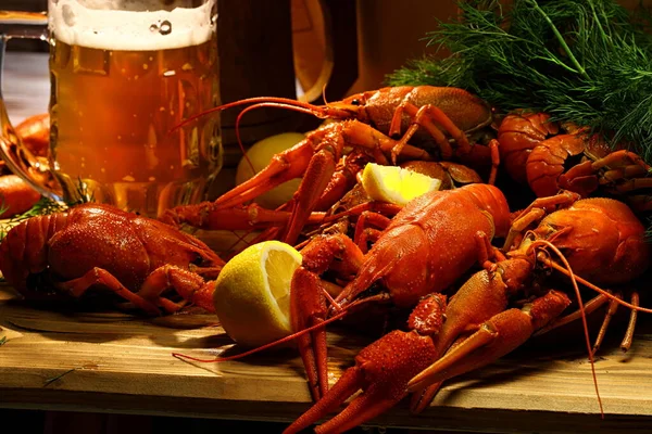 Crayfish with beer on a wooden table