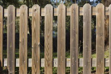 Wooden fence forbidding the access to nature.