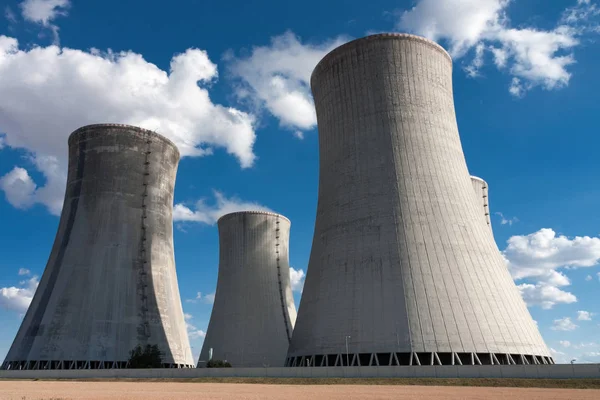 Nuclear power station, cooling towers against blue sky
