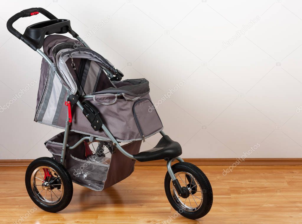  New modern comfortable grey pet stroller, studio shot 