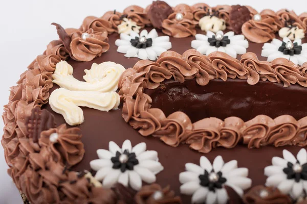 Close up of birthday sponge cake with chocolate cream — Stock Photo, Image