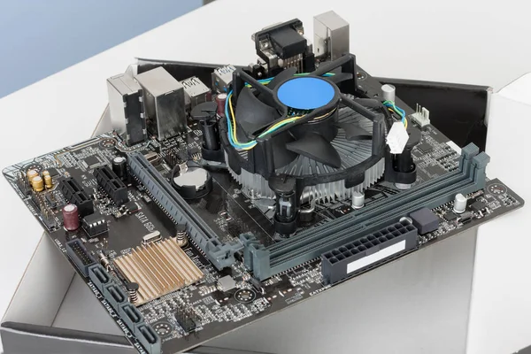 CPU cooler fan is installing on new, modern motherboard