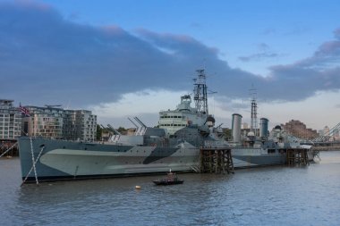 Warship  HMS Belfast on the river Thames in London, England. clipart