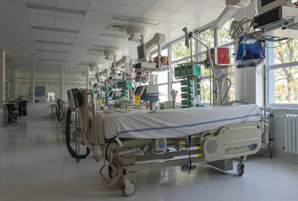 Intensive care unit in hospital, beds with monitors an ventilators, a place where they are treated patients with pneumonia caused by coronavirus covid 19
