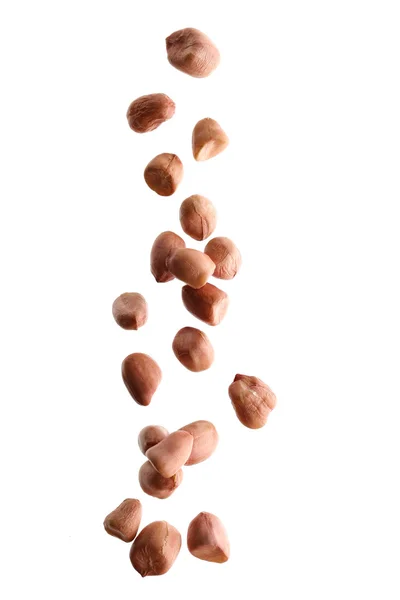 Etwas Geschälte Erdnüsse Fallen Auf Weißem Hintergrund — Stockfoto