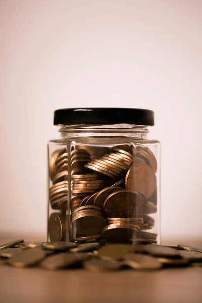 Coins In Glass Money Jar