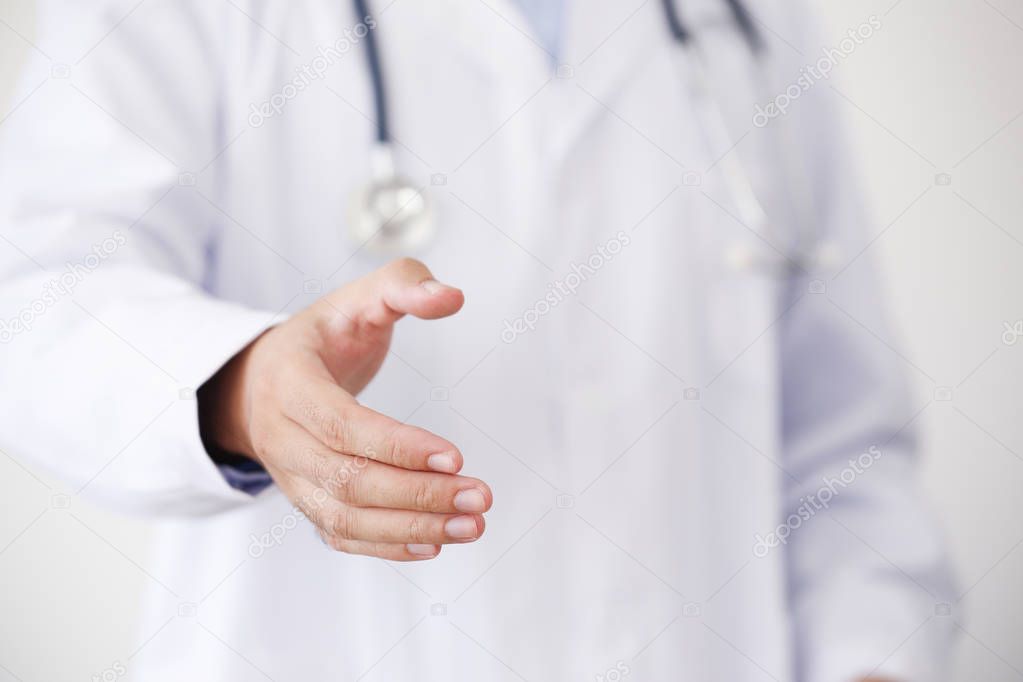 Doctor Offering Hand To Shake