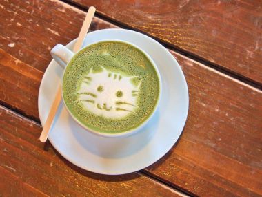 Matcha green tea latte with latte art 'Cat face'