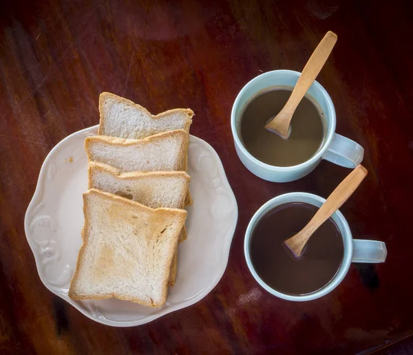 Breakfast time with two coffee and bread — Stock Photo, Image