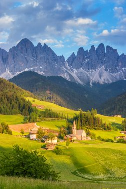 Santa Maddalena village in front of the Odle Dolomites Group clipart