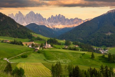 Santa Maddalena village in front of the Odle Dolomites Group clipart