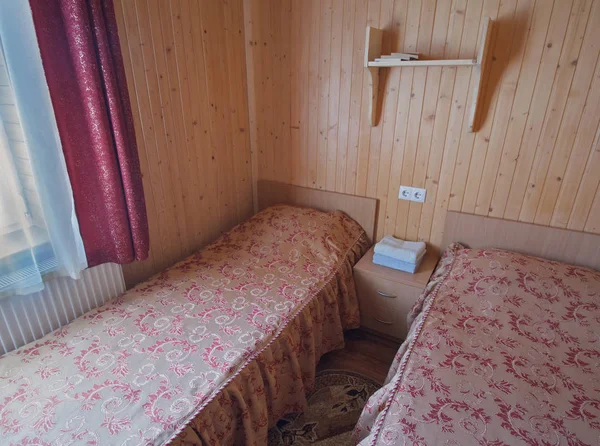 Interior of double room with separate beds