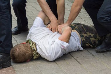 Police used physical force to the suspected person clipart