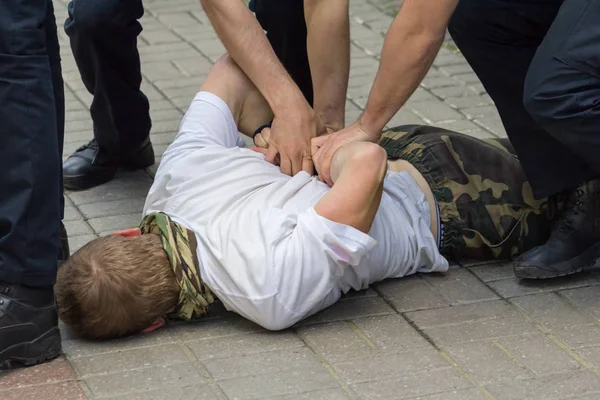 Police used physical force to the suspected person — Stock Photo, Image