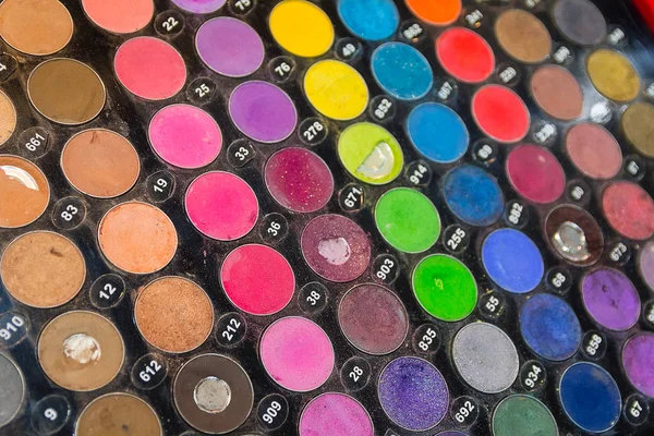 Makeup eye shadows on the counter close-up. Sale