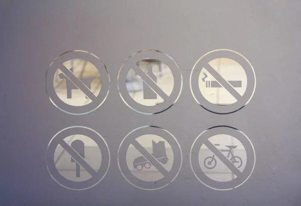 Prohibiting signs on the door to the supermarket — Stock Image Prohibiting signs on the door to the supermarket Stock Image