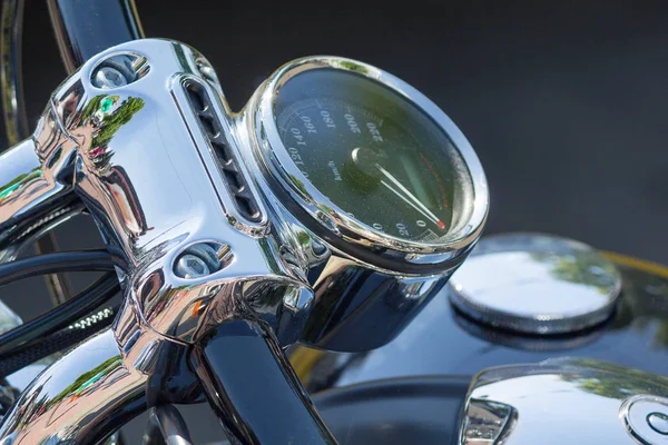 Chromed speedometer retro motorcycle closeup. Transport