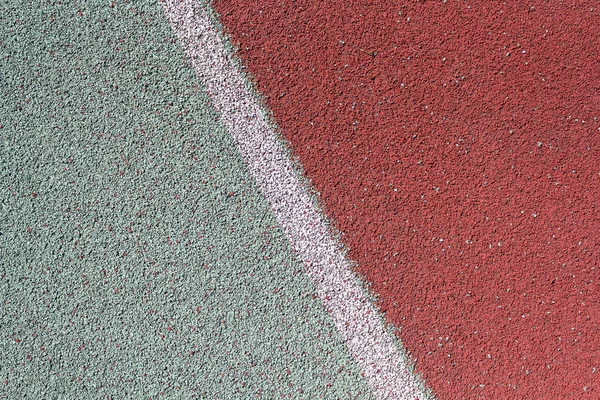 Färgad gummi beläggning av Stadions löp band. Bakgrunder och texturer — Stockfoto