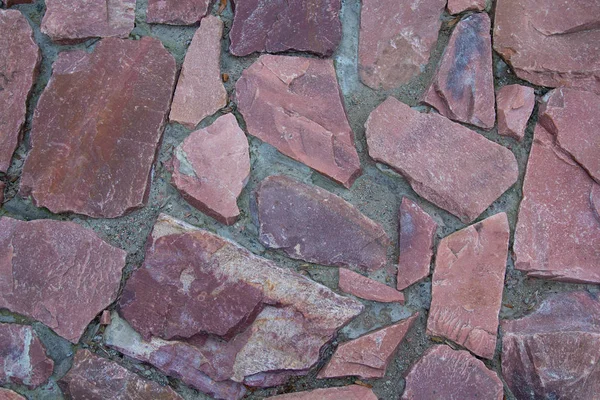 Piedras de granito pavimento primer plano. Fondos y texturas — Foto de Stock