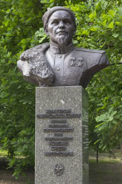 Kiev, Ukraine - May 18, 2019: Monument to the leader of the guerrilla movement, General Sidor Kovpak, in the Park of Eternal Glory clipart