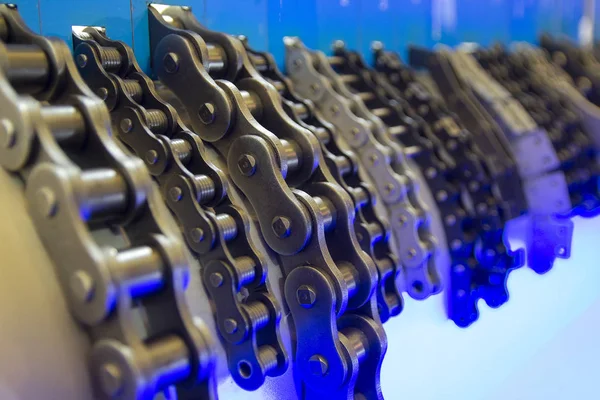 Roller chains in a row close up — Stock fotografie