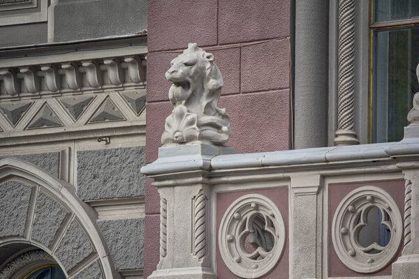 Lion's head as a decoration railing of a historic building. Architecture