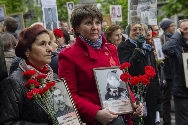 Kiev, Ukraine - May 09, 2019: Citizens with portraits of the ancestors who died - warriors on the march on the anniversary of the victory in World War II
