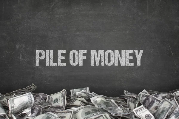 Pile of money text on black background — Stock Photo, Image