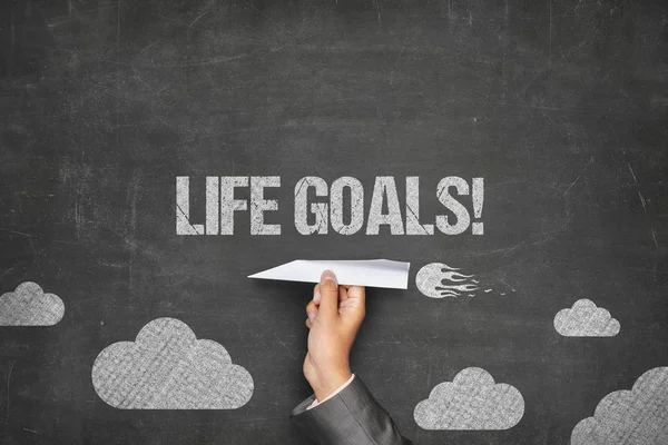 Life goals text on blackboard with paper plane — Stock Photo, Image