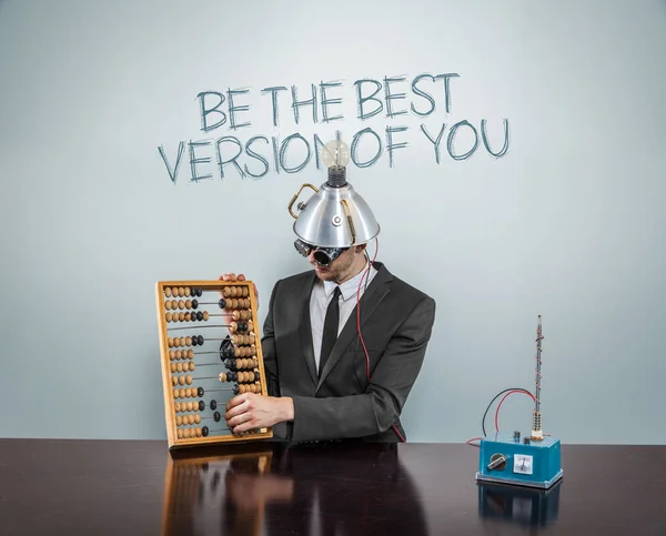 Be the best version of you text on blackboard with businessman — Stock Photo, Image