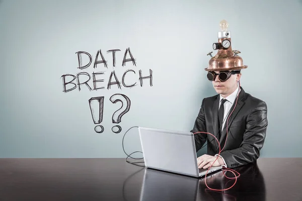 Data breach text with vintage businessman using laptop — Stock Photo, Image