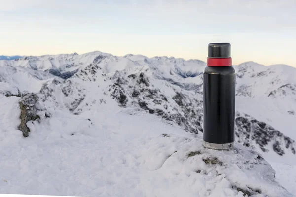 Thermos in the mountains.