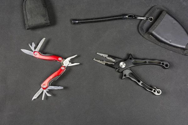 Pliers and folding multifunctional tool for anglers. — Stock Photo, Image