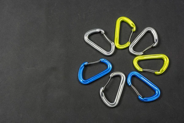 Different colors of climbing carabiners. — Stock Photo, Image