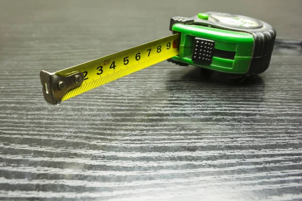 Self-retracting metal tape measure. — Stock Photo, Image