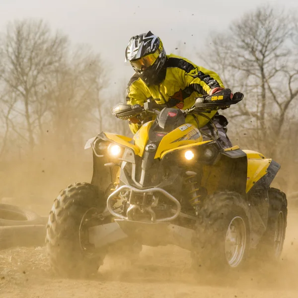 ATV rider in a large cloud of dust and debris. — Stock Photo, Image