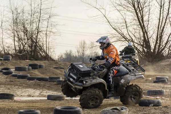 All-terrain vehicle driver drifts and stunts on a sand rough terrain, turns on a two wheels in a moment before accident. — Stock Photo, Image