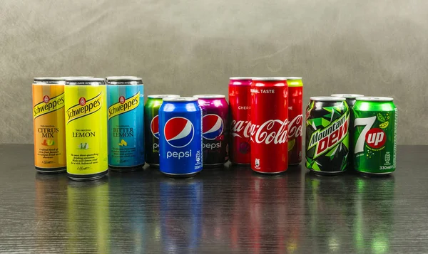 A set of cans with various carbonated soft drinks. — Stock Photo, Image
