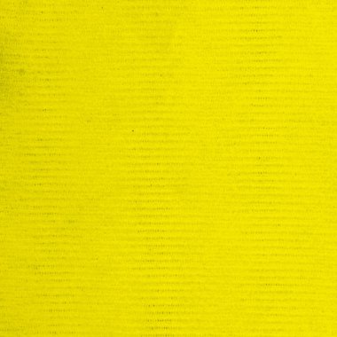 Kare ve mikrofiber kumaş desen olarak sarı. Yapının ayrıntılarına yakın çekim.