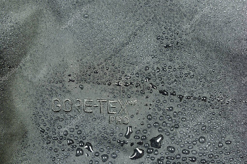 Niedomice, Poland - May 06, 2019: Effect of water repellent on a shell layer Gore-Tex Pro jacket.