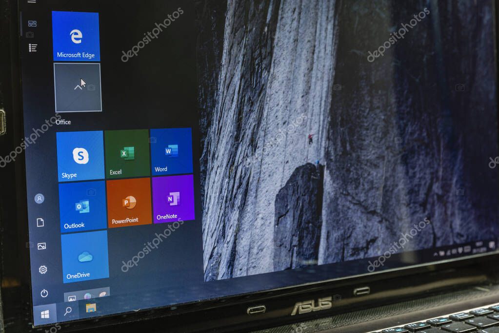 Niedomice, Poland - November 29, 2019: Open Start Menu (Windows 10 operating system) on an Asus laptop. The menu includes tiles from Microsoft Edge and Microsoft Office.
