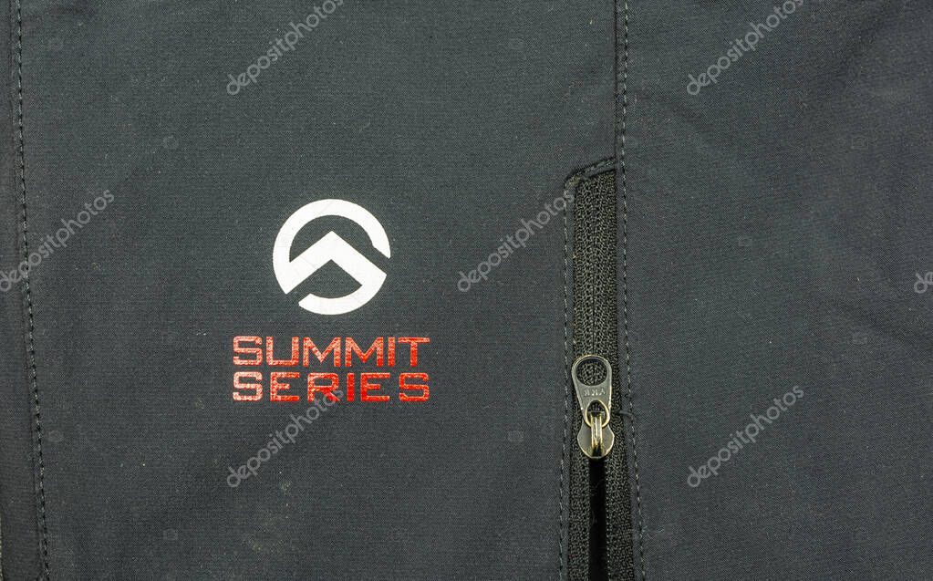 Niedomice, Poland - November 21, 2019: Summit Series logo of the American manufacturer The North Face (TNF) placed on outdoor clothing by the zipper (YKK).