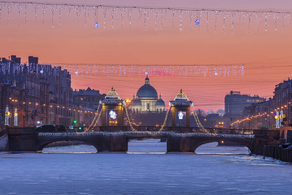 Saint Petersburg Lomonosov Bridge and Trinity Cathedral at sunse