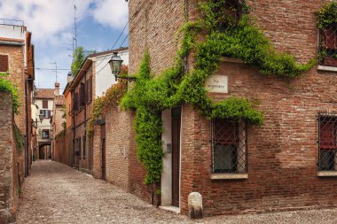 Ferrara, old narrow street, Italy clipart