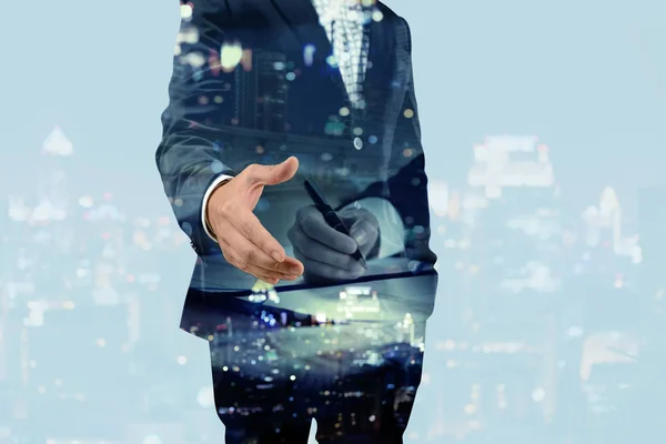 Double exposure of businessman giving his hand for handshake wit