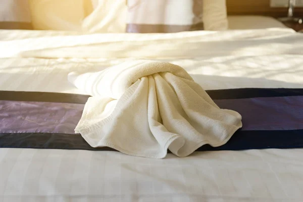 White towel decoration on bed in bedroom hotel — Stock Photo, Image