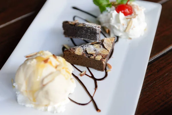 Chocolate Brownie with Vanilla Ice Cream and Whipped Cream — Stock Photo, Image