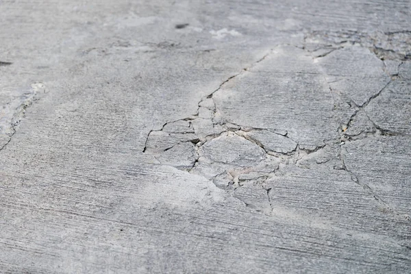 Top view of cracks on concrete road — Stock Photo, Image