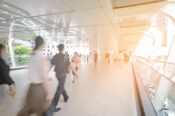 Blurred people walking on skywalk under electric train station in Bangkok City, Thailand - City Concept — Stock Photo, Image